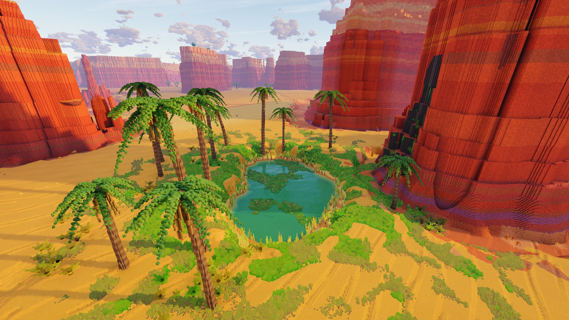 A palm oasis between red cliffs